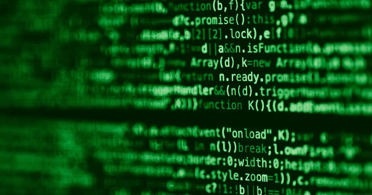 Blurred lines of source code on a computer screen