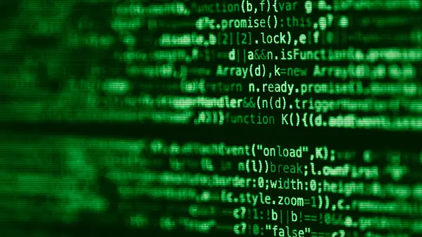 Blurred lines of source code on a computer screen