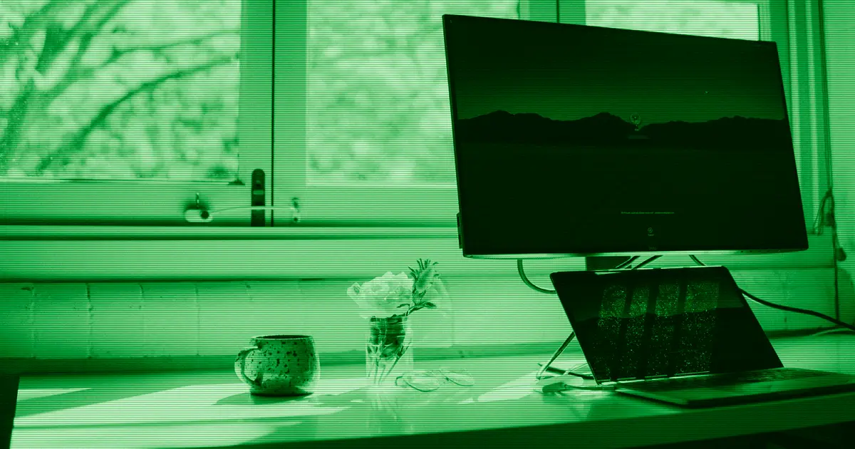 A laptop and a monitor on a work desk