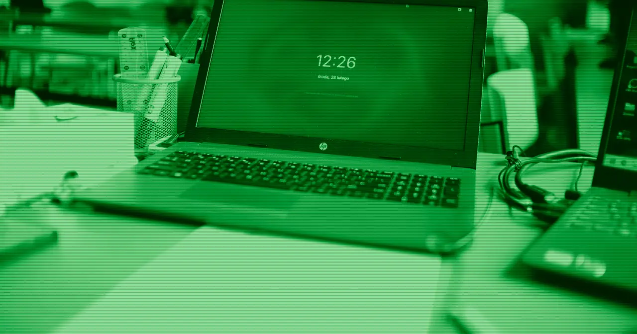A lightweight open laptop on a minimalist desk, evoking the Chromebook experience