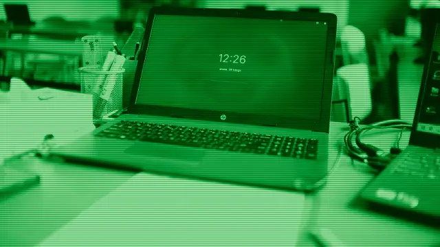 A lightweight open laptop on a minimalist desk, evoking the Chromebook experience