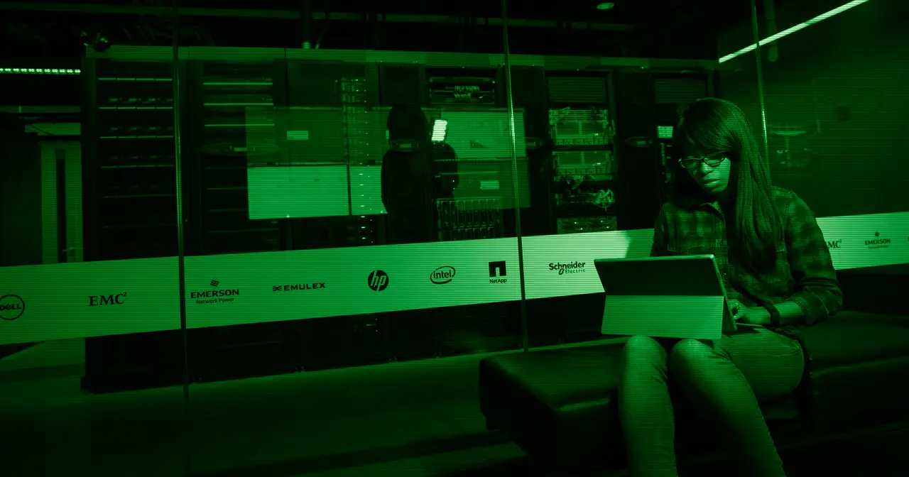 Server room with code on screen, evoking the infrastructure that Linux powers today