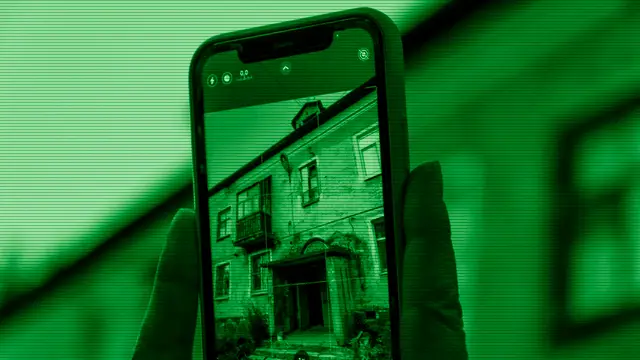 Hand holding an old smartphone given a second life